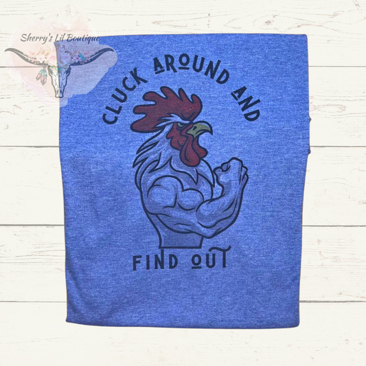 Blue shrot sleeve tee with rooster. cluck around and find out text